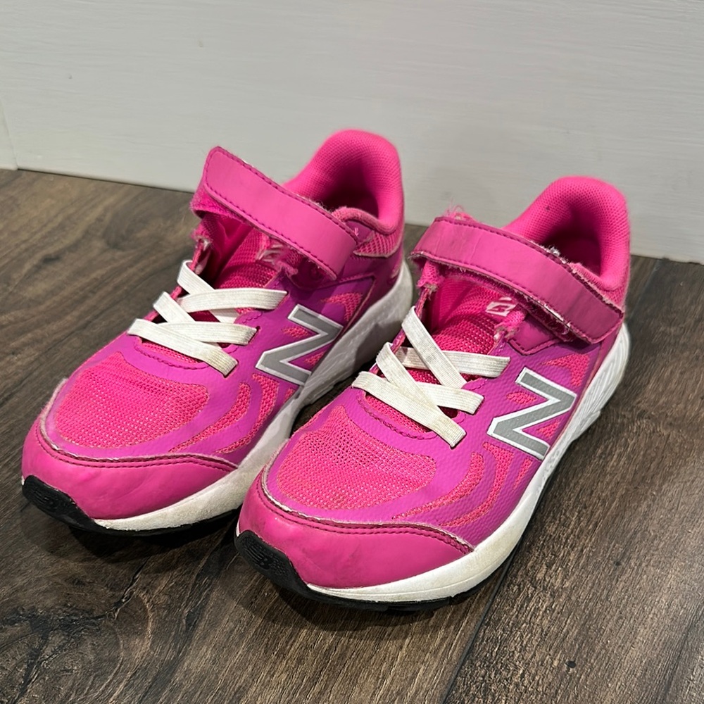 New Balance Pink and White Sneakers with straps and elastic laces.